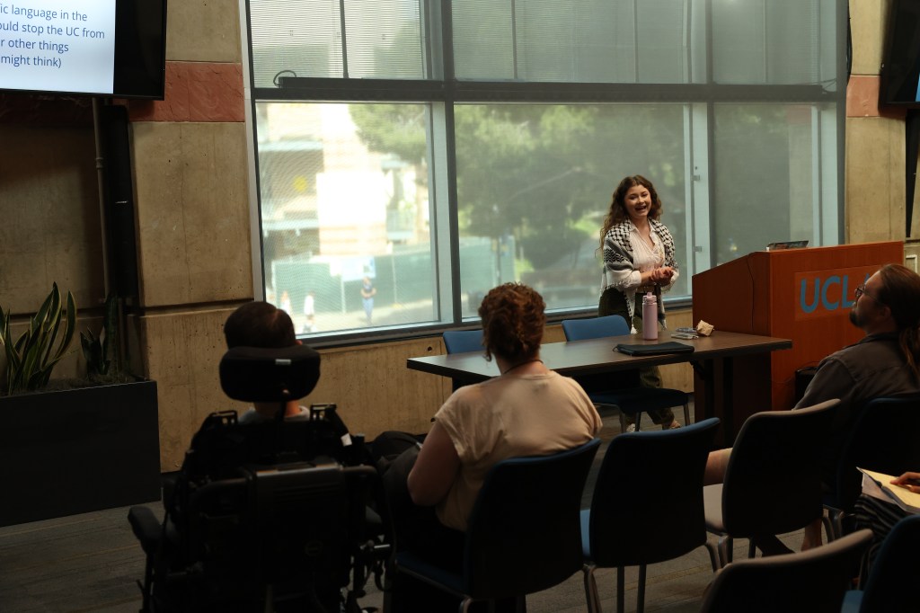 A woman giving a presentation.