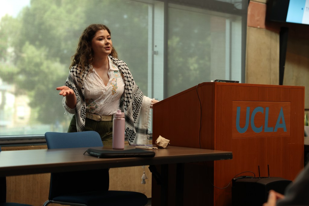 A woman giving a presentation.
