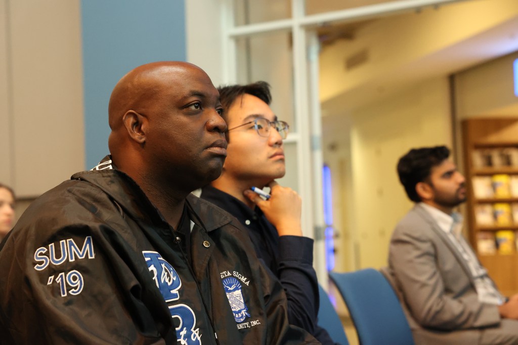 Three men from diverse backgrounds.