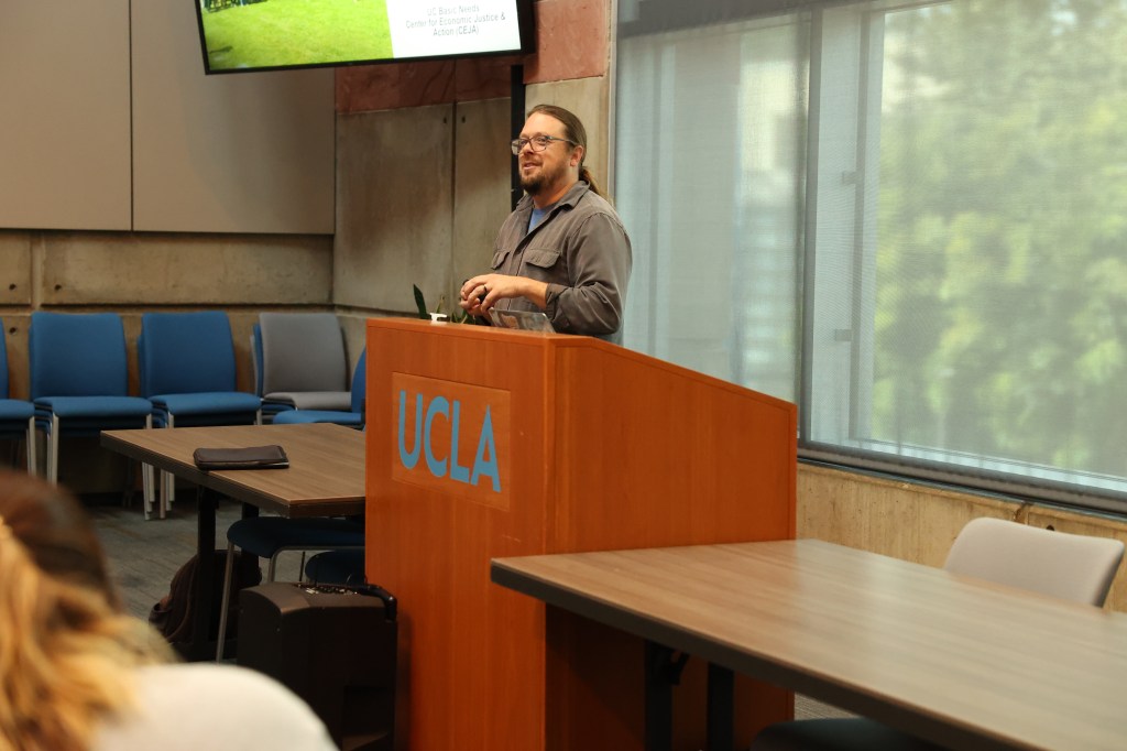 A man talking and giving presentation.